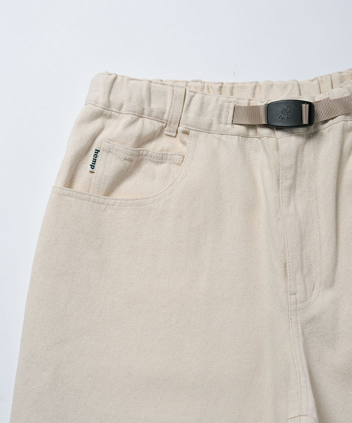 Close-up view of natural colored Gramicci Hemp Denim Pants on a light-tone background.