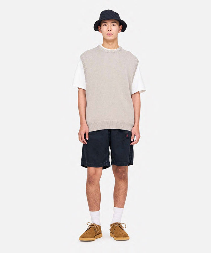 Model wearing hemp black colored Gramicci Hemp G-Shorts and a beige sweater on a light-tone background.