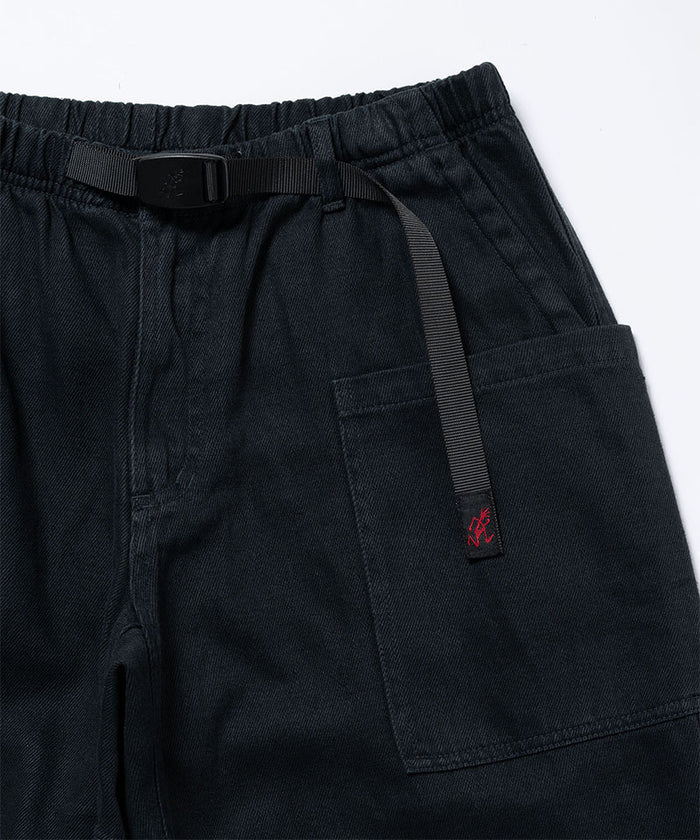 Close-up view of carbon colored Gramicci Hemp Relaxed Pants on a light-tone background.