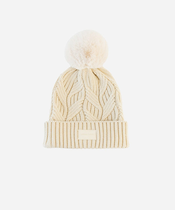 A cream knit beanie with a pom-pom on a plain background #color_cream