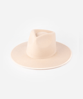 A nude colored fedora hat against a plain background #color_pale nude
