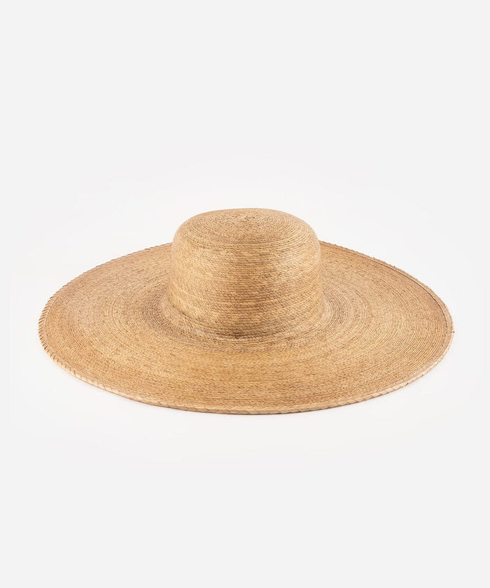 A natural brown colored wide brim boater hat made of straw, displayed against a white background. #color_natural brown
