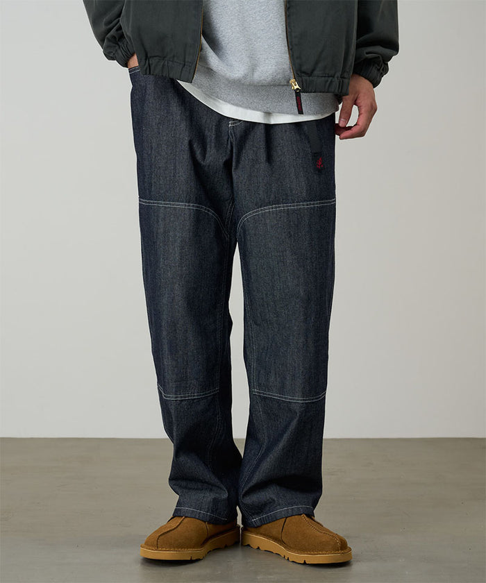 Gramicci Japanese Chambray Double Knee pant in navy worn by a model against a light tone background.