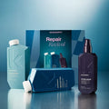 Kevin Murphy Repair Revival hair care set featuring a Repair Revival box, a teal PepiRide Wash bottle, a dark purple Young-Again spray bottle, and a blue Repair Mask box on a reflective blue surface.