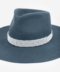 Blue fedora hat with a white lace band on a white background #color_white