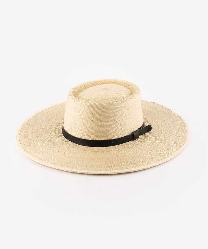 A natural colored straw boater hat with a wide brim, featuring a black genuine leather band. #color_natural