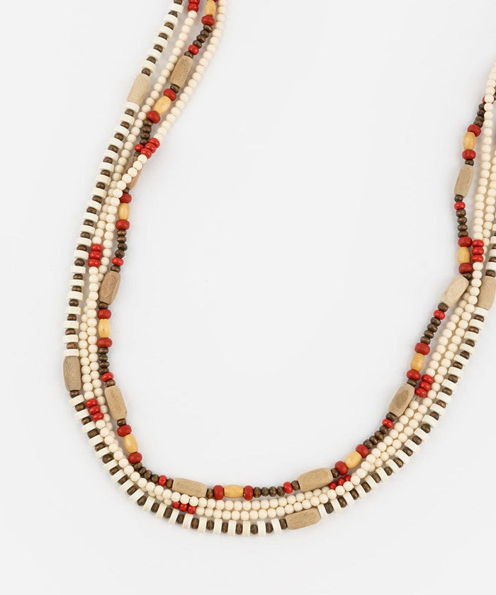 A natural colored layered beaded hat band on a plain background #color_natural