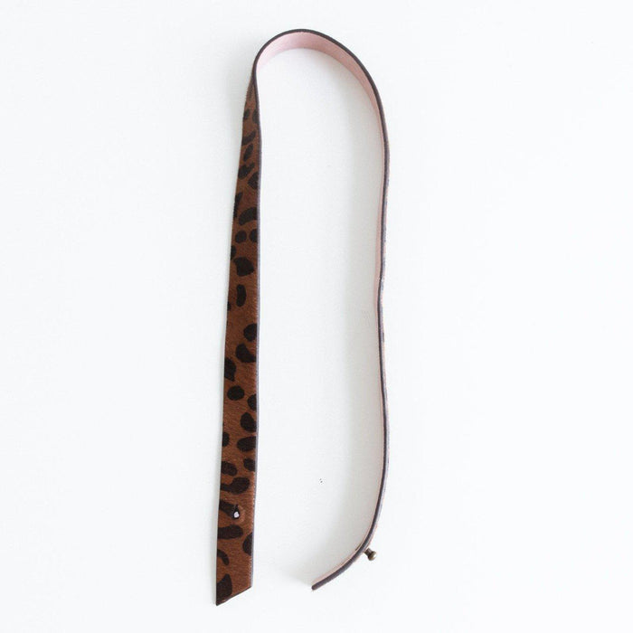 A dark brown leopard print hat band on a plain background #color_dark brown