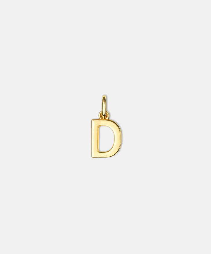 Gold letter 'D' hat charm on a white background #color_gold