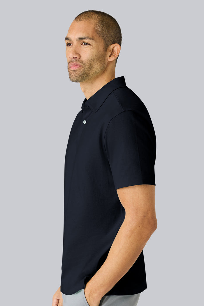 Side view of a man wearing Linen Jersey Polo in Total Eclipse