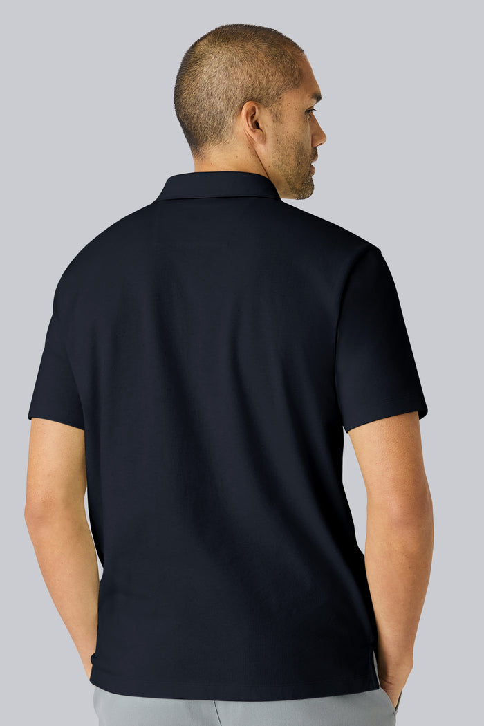 Back view of a man wearing Linen Jersey Polo in Total Eclipse