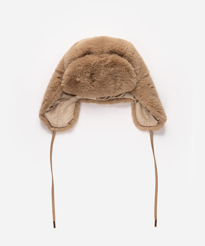 A tan fur hat with ear flaps on a white background #color_tan