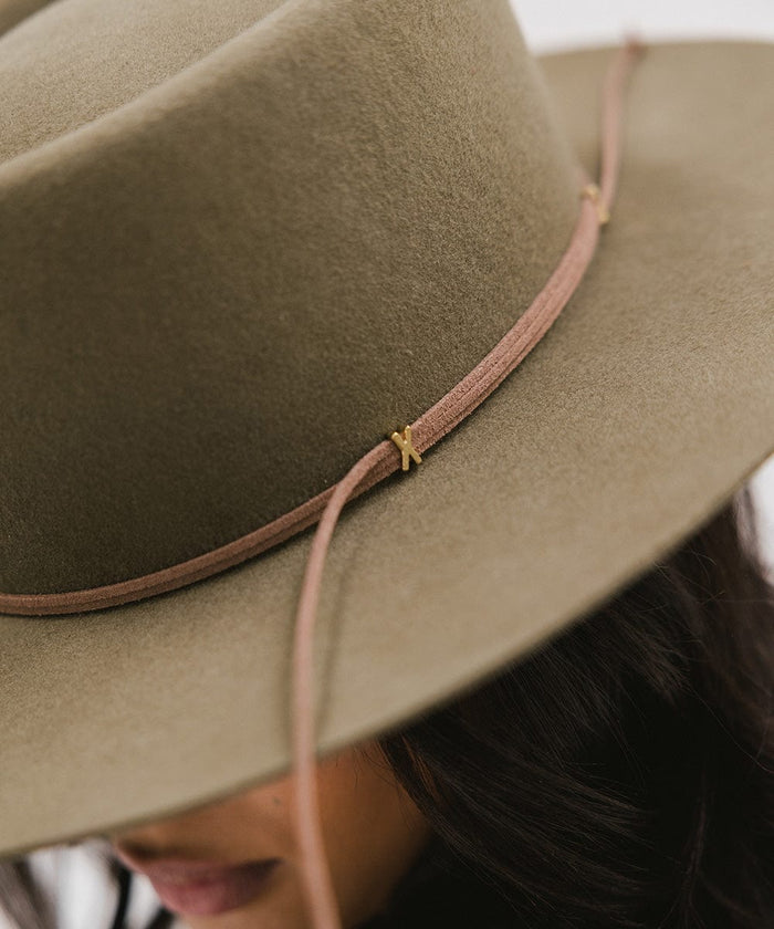 A close-up image of an aloe colored  Maise Classic Flat Brim Hat with a hat band #color_aloe