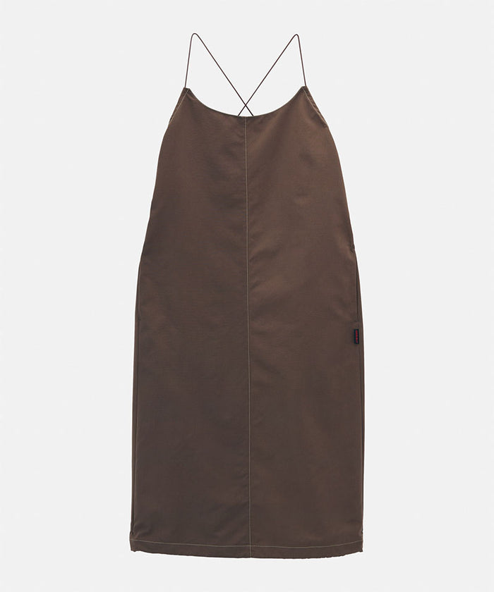 Model wearing a Gramicci Women's Woven Milton Dress in the color walnut on a light-tone background.