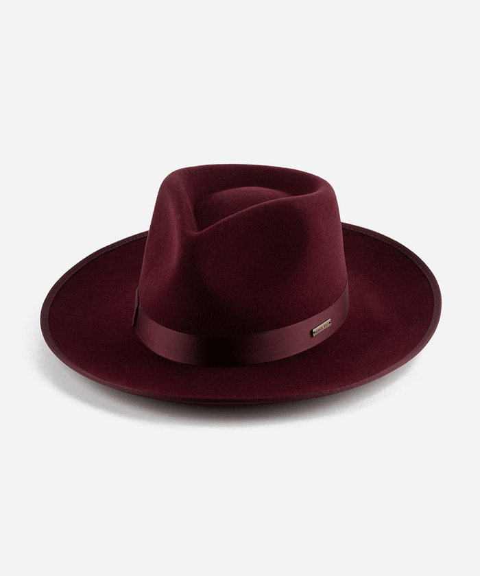A wine colored fedora hat with a band on a white background #color_wine