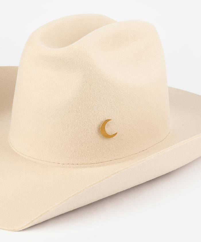 Pink cowboy hat with a gold moon-shaped hat pin on a white background #color_gold