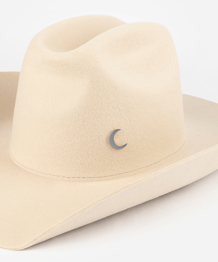 Pink cowboy hat with a silver moon-shaped hat pin on a white background #color_silver
