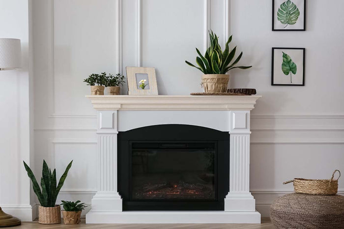 Retique It Multi-purpose Smooth Finish Kit in White Wash for interior wood surfaces, featuring a matte top coat on a fireplace mantle.