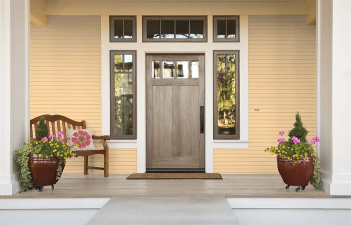 Retique It Wood'n Finish Kit in Weathered Wood showing a front door with a textured, grained wood surface.