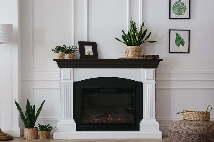 Retique It Wood'n Finish Kit in Classic Black, medium size, showing interior fireplace mantle with smooth black wood finish.