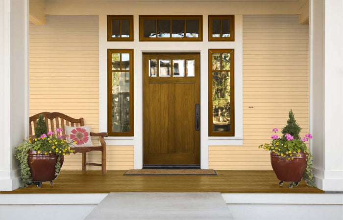 Retique It Multi-purpose Wood'n Kit in Dark Pecan for wood finishing, featuring brushes and finish products on a door surface.