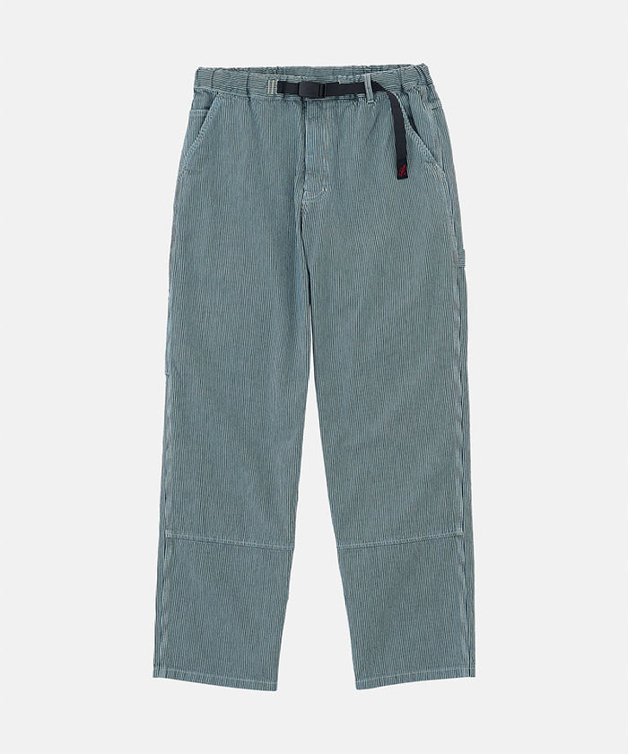 Navy Gramicci Overdyed Hickory Work Pants with a belt against a light-tone background.