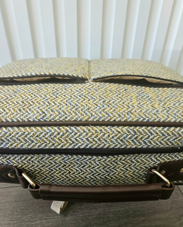 Suitcase style bag with zippers.