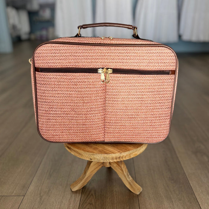 Pink suitcase bag.