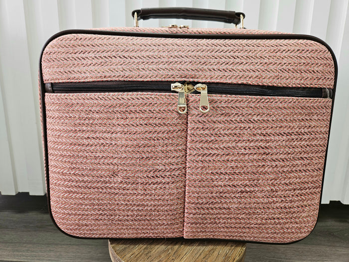 Pink suitcase bag.