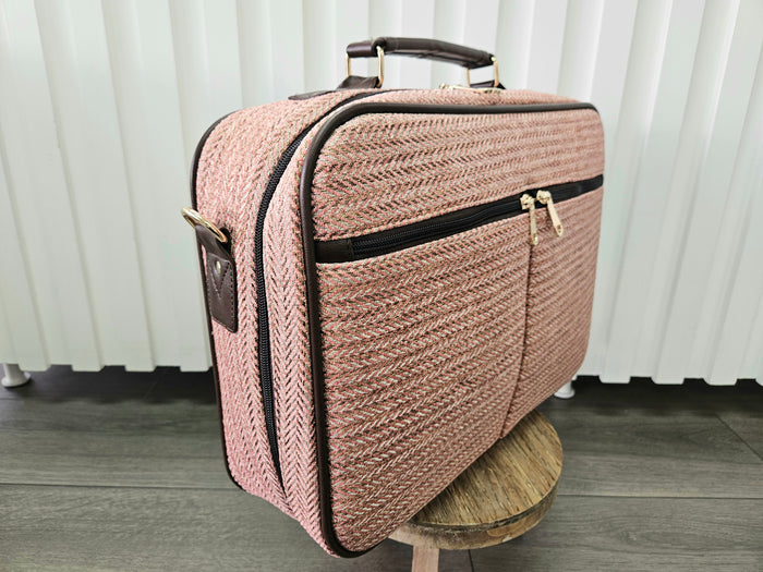 Pink suitcase bag.