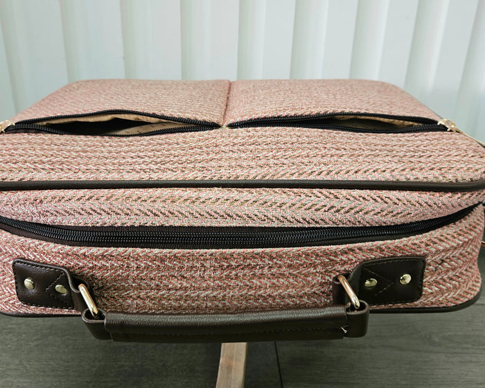 Pink suitcase bag.