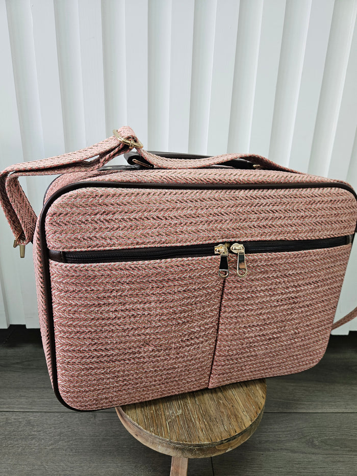 Pink suitcase bag.