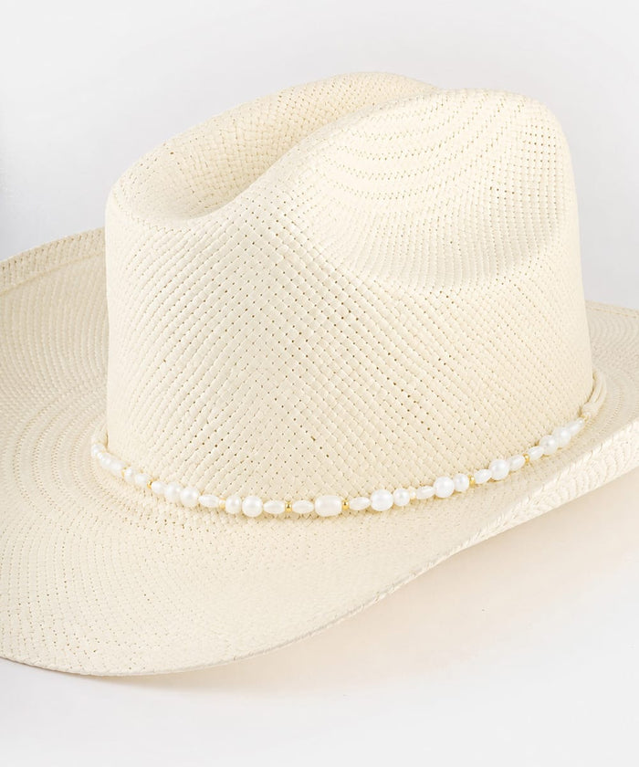 Beige straw hat with a beaded band on a white background #color_white