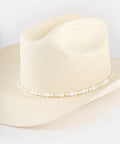 Beige straw hat with a beaded band on a white background #color_white