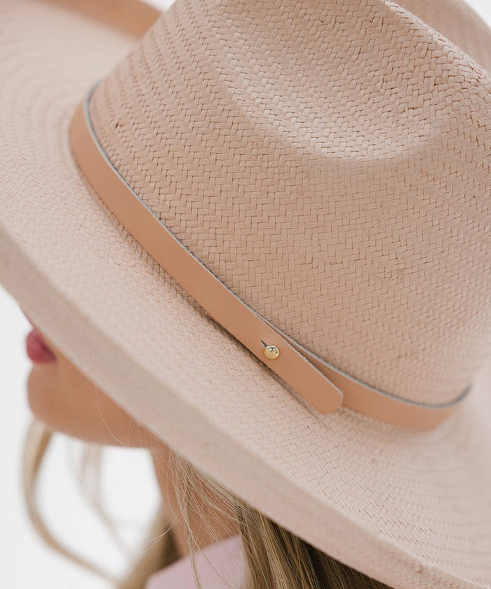 A light pink pencil brim straw fedora hat with a hat band #color_limited edition light pink
