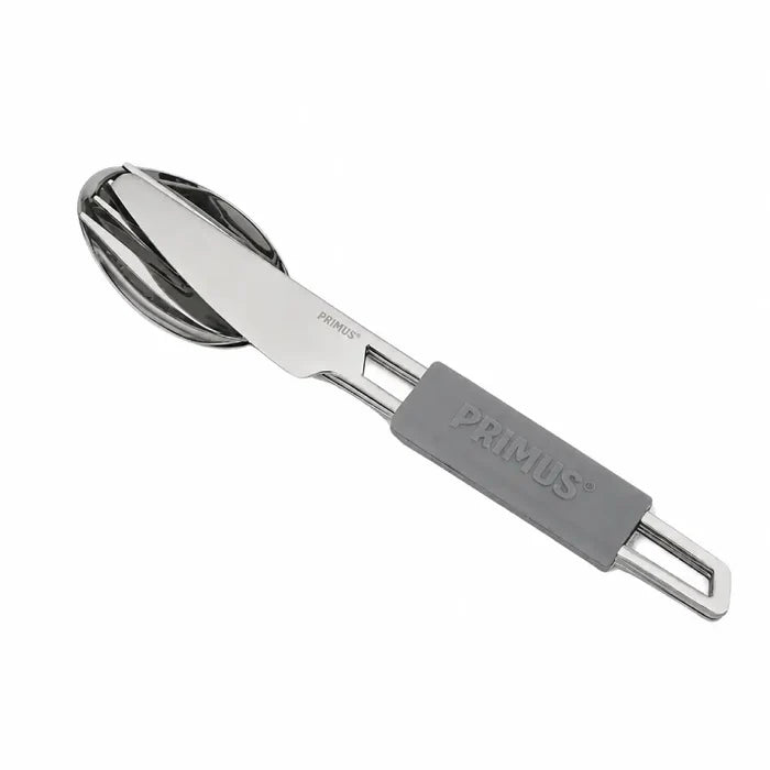 Primus stainless steel leisure cutlery set held together with a Grey silicon sleeve on a white background