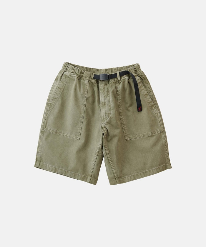 Herb pigment Gramicci Ridge Short with a belt against a light-tone background.