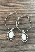 Saddle Stories hoop earrings featuring white turquoise oval stones, antique silver western detailing, and classic hoop styling for western-inspired outfits and everyday wear.