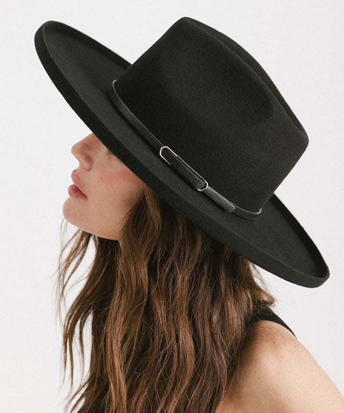Woman wearing a black wide-brimmed hat with a black hat band, posing sideways against a plain background #color_black - silver