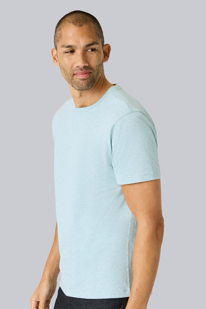 Side view of a man wearing Slub Crew Neck T-Shirt in Nile Blue Heather