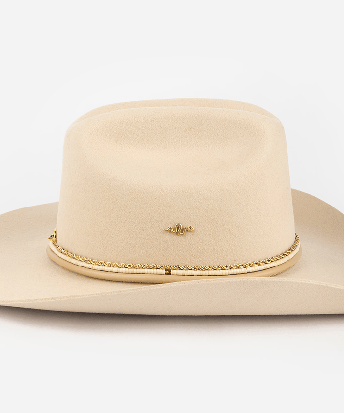Beige cowboy hat with a gold chain band on a light gray background #color_gold