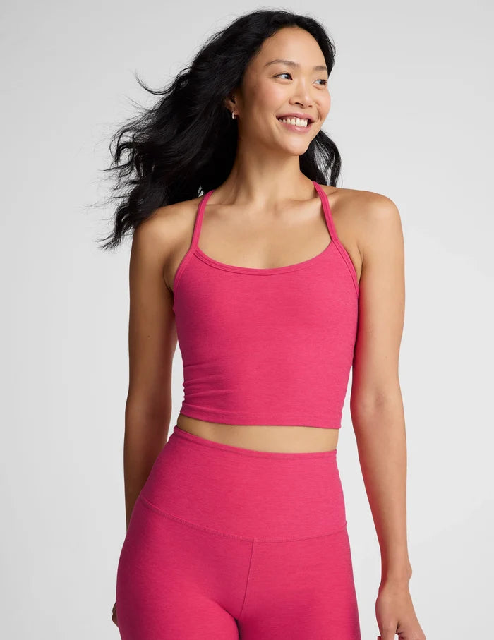 Woman wearing Beyond Yoga SpaceDye Slim Racerback Cropped Tank in vivid pink