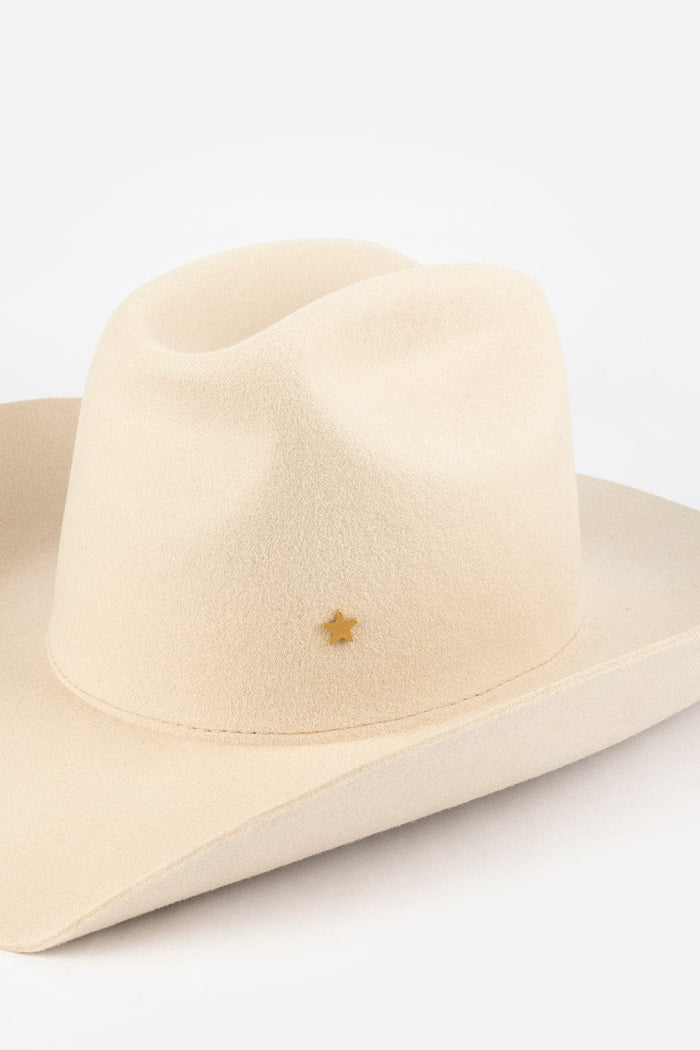 Pink cowboy hat with a gold star-shaped hat pin on a white background #color_gold
