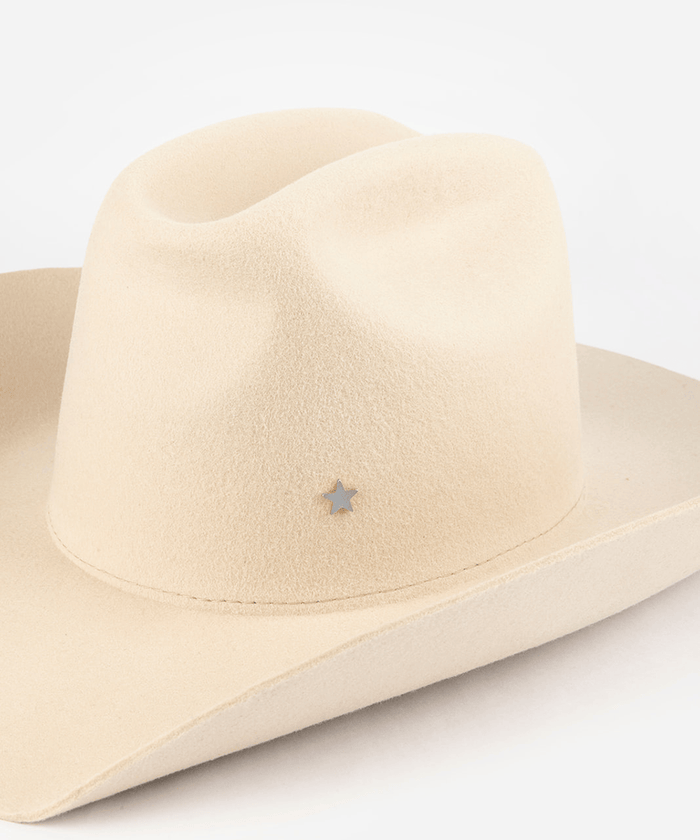Pink cowboy hat with a silver star-shaped hat pin on a white background #color_silver