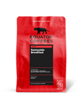 Red Sunnyside Breakfast coffee bag with black tasting notes panel and branding.