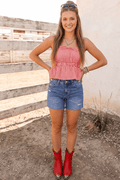 Red gingham peplum tank top styled with denim shorts and red cowboy boots, perfect for country concerts, Fourth of July outfits, rodeos, summer festivals, and Americana-inspired western fashion.