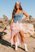 Pink lace skort featuring built-in shorts and an asymmetrical ruffle overlay, styled for country concerts, summer festivals, and feminine western outfits.