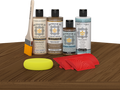 Retique It® Barn Wood Wood'n Kit with Light Wood Primer, Barn Wood Wood'n Stain, Matte TripleTique Top Coat, Pecan Gel Stain Alternative, yellow sponge, red graining tool, and brush.