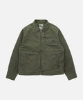 Gramicci moss green Taos Canvas Jacket against a light-tone background.