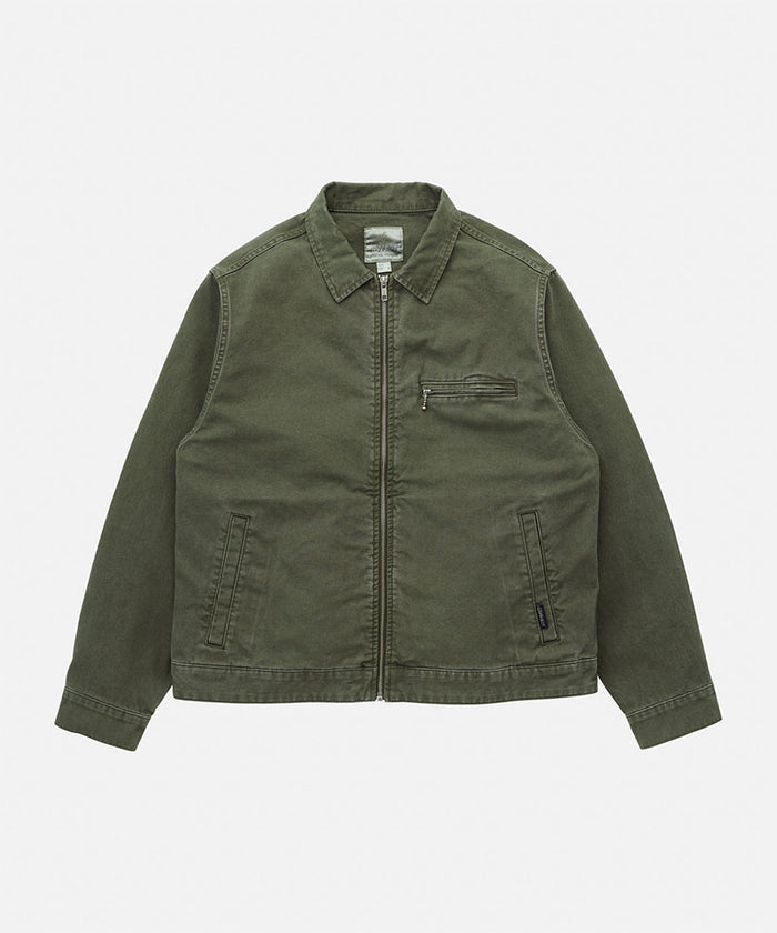 Gramicci moss green Taos Canvas Jacket against a light-tone background.